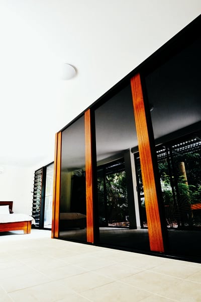 Bedroom Sliding Doors Frames with Queensland Pencil Timber. Panel is Translucent Glass