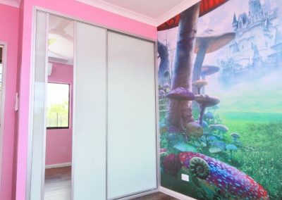 Girls Bedroom With Pink Walls and sliding glass doors