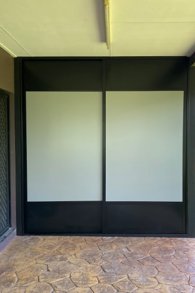 Outside laundry cupboard with ventilated sliding doors