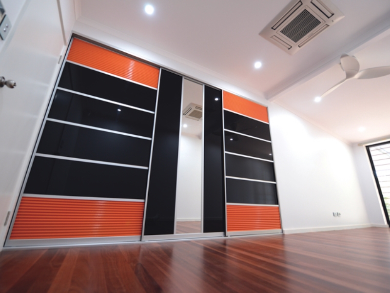 Built In Robe with Black glass and Orange Mesh JM Interiors