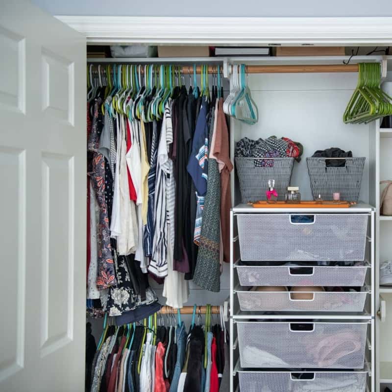 Wardrobe with hinge closet doors opening into the room