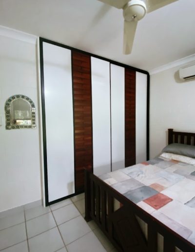 Robe Doors with Slatted Timber Design on White Panel