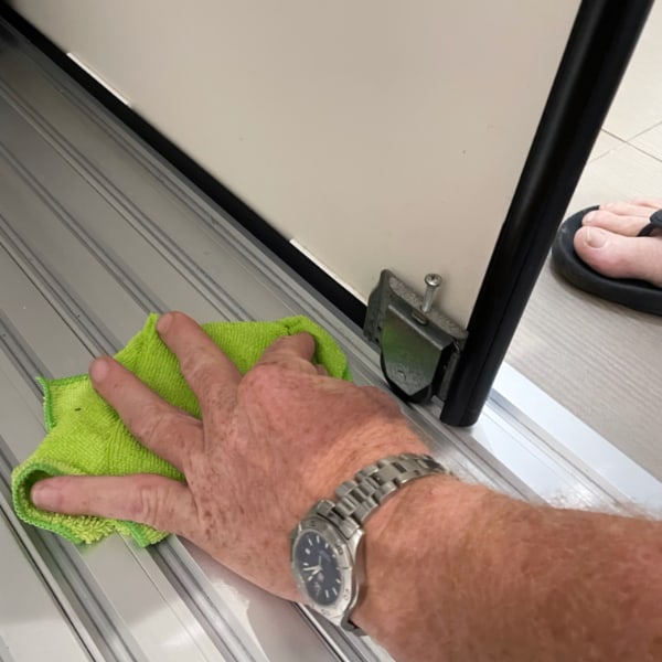 1 Cleaning Sliding Door Rollers use a damp rag