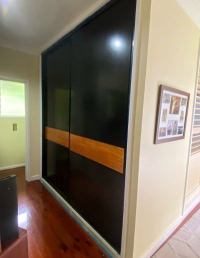 Hallway Cupboard Doors (after photo) New Sliding Doors with timber feature to match floors