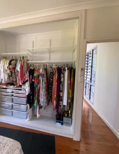 Wardrobe Layout with elfa shelving. Pull out wire baskets and hanging