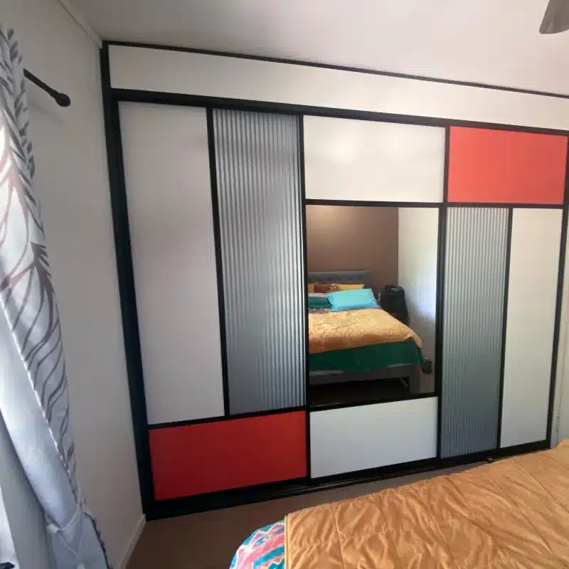 After Image: The same bedroom with new modern sliding doors